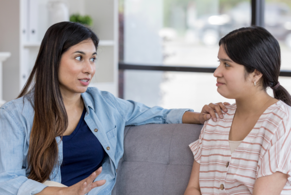 mom talking to her daughter