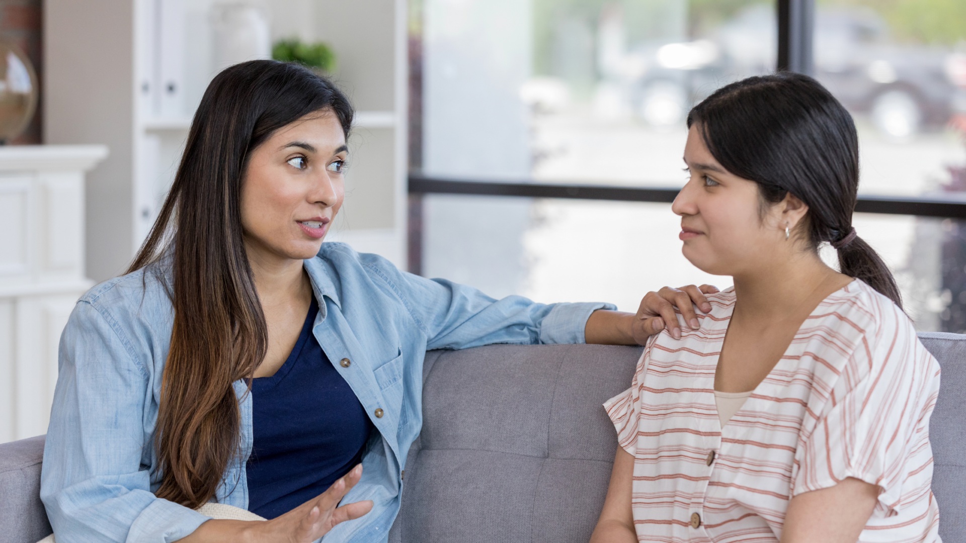 mom talking to her daughter